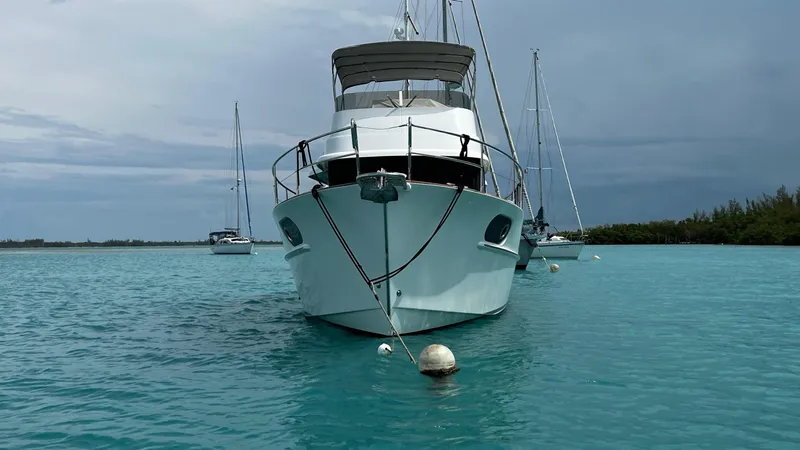 Libertad Yacht Photos Pics 2020 Beneteau Swift Trawler 44 anchored in turquoise waters, front view.