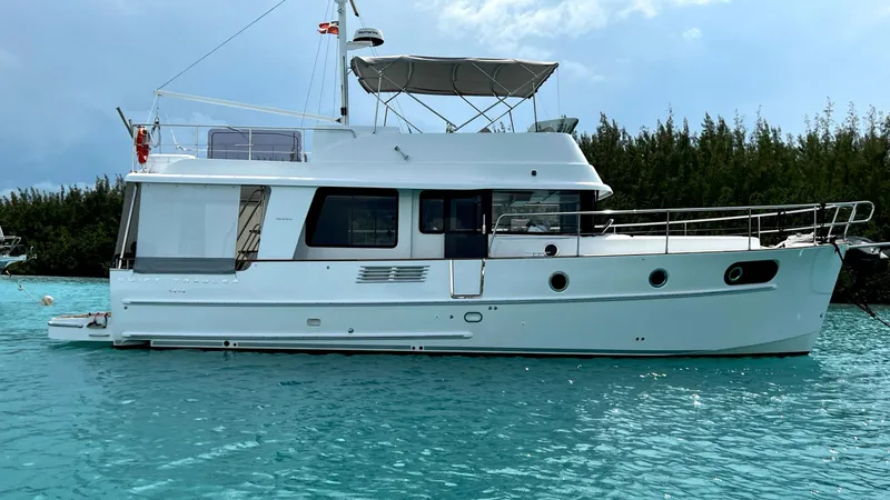 Libertad Yacht Photos Pics 2020 Beneteau Swift Trawler 44 on turquoise water, side view.