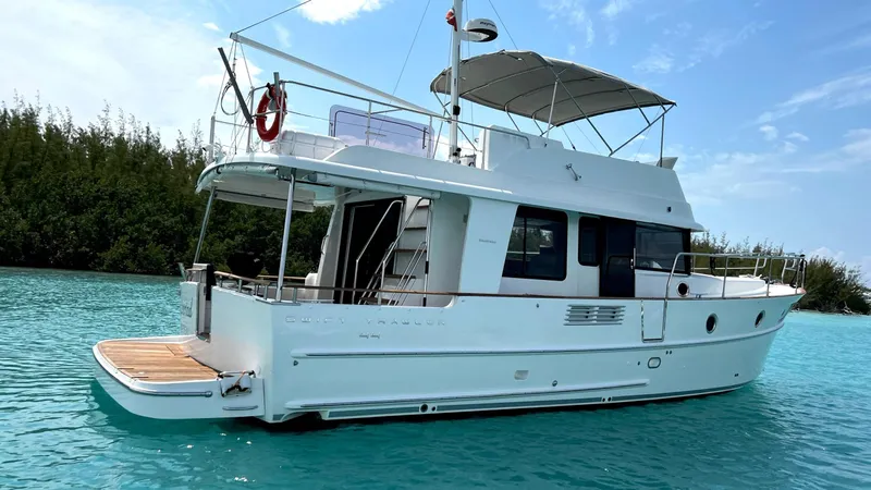 Libertad Yacht Photos Pics 2020 Beneteau Swift Trawler 44 on turquoise water, side view.