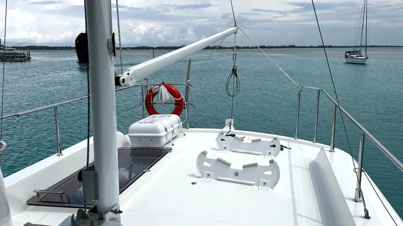 Libertad Yacht Photos Pics 2020 Beneteau Swift Trawler 44 on calm waters, featuring spacious deck and safety equipment.