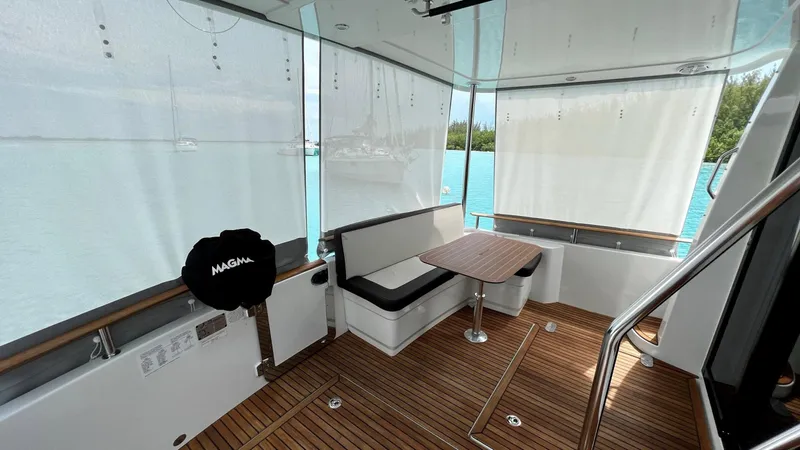 Libertad Yacht Photos Pics 2020 Beneteau Swift Trawler 44 interior with wood flooring and seating area.