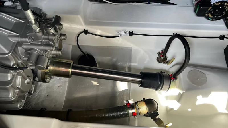 Libertad Yacht Photos Pics Engine compartment of 2020 Beneteau Swift Trawler 44, showcasing mechanical components and hoses.