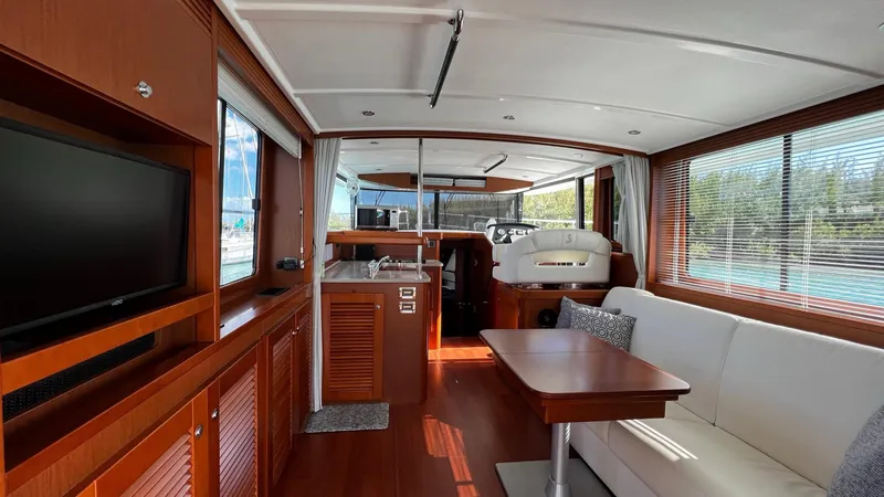 Libertad Yacht Photos Pics Interior of 2020 Beneteau Swift Trawler 44, featuring elegant wood finishes and modern amenities.