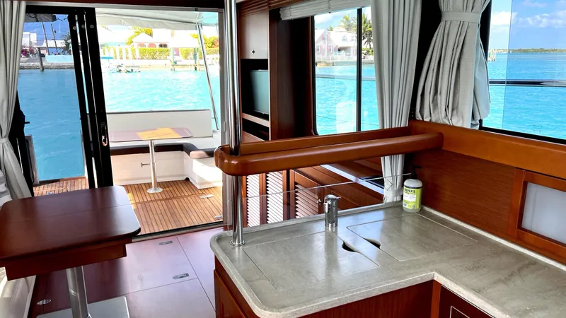 Libertad Yacht Photos Pics Interior view of 2020 Beneteau Swift Trawler 44 with ocean backdrop.