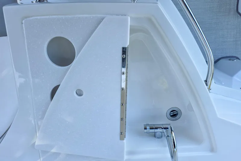  Yacht Photos Pics 2022 Monterey 295 Sport Yacht interior detail with sleek white panel and chrome fixtures.
