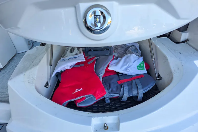  Yacht Photos Pics Storage compartment of 2022 Monterey 295 Sport Yacht with life jackets and gear.