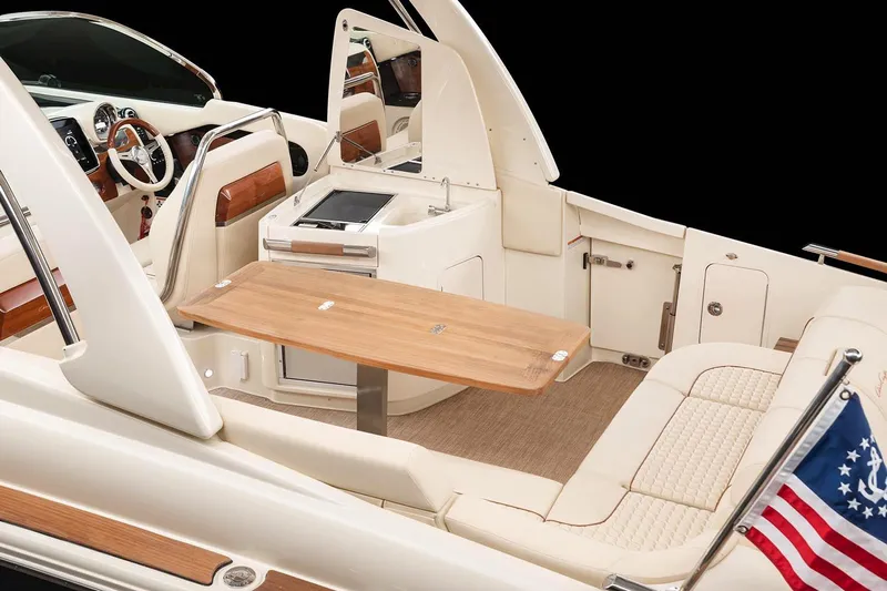  Yacht Photos Pics Manufacturer Provided Image: 2023 Chris-Craft Launch 31 GT interior with luxurious seating and wooden table.