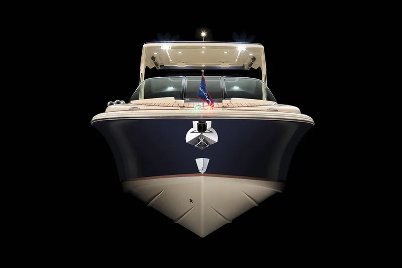  Yacht Photos Pics Manufacturer Provided Image: 2023 Chris-Craft Launch 31 GT boat, front view, illuminated against a black background.