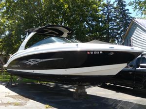 2008 Chaparral SSX 276 boat on display, black and white design, parked outdoors.