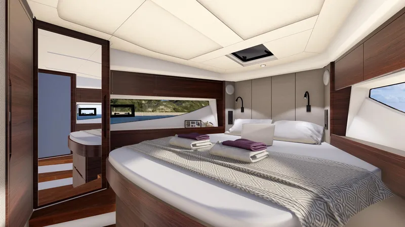  Yacht Photos Pics Luxurious cabin interior of 2025 Marex 390 yacht with modern design and comfortable bedding.
