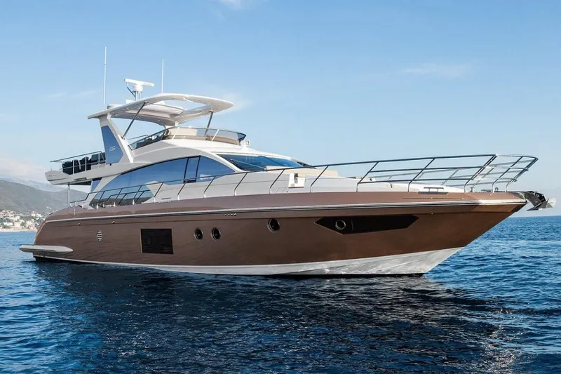  Yacht Photos Pics 2017 Azimut 66 yacht cruising on open water under clear blue skies.