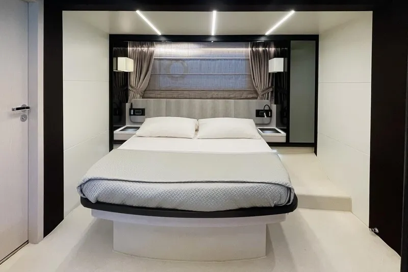  Yacht Photos Pics Luxurious bedroom interior of 2017 Azimut 66 yacht with modern design and elegant furnishings.