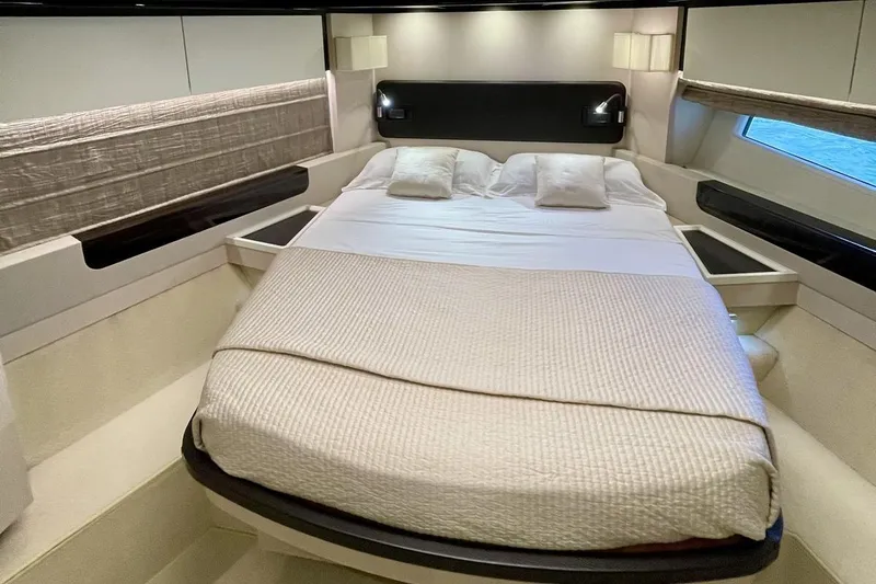  Yacht Photos Pics Luxurious bedroom interior of 2017 Azimut 66 yacht with elegant bedding and modern design.