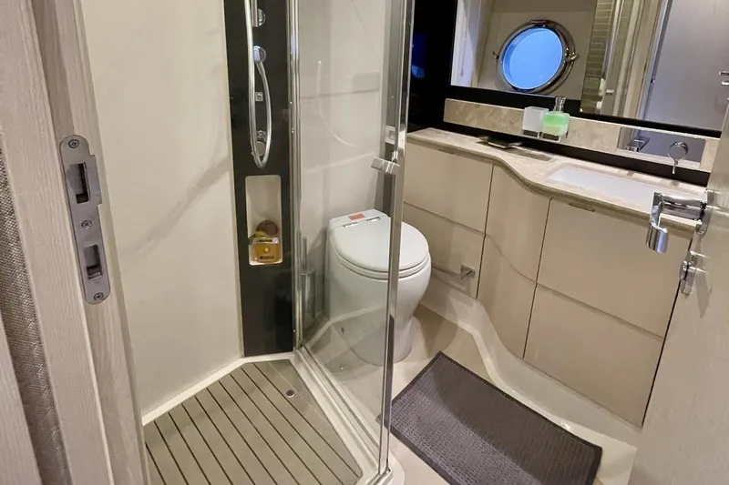  Yacht Photos Pics Luxurious bathroom in 2017 Azimut 66 yacht with modern fixtures and elegant design.