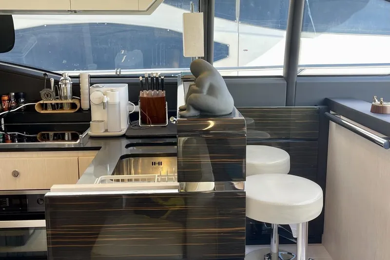  Yacht Photos Pics Luxurious kitchen interior on a 2017 Azimut 66 yacht with modern amenities.