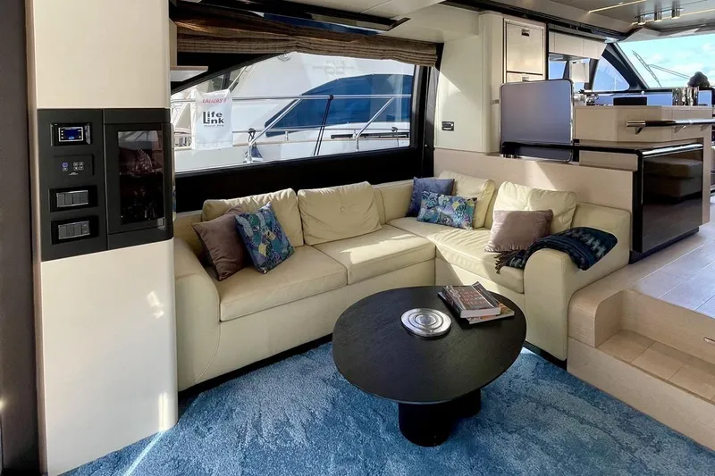  Yacht Photos Pics Luxurious interior of 2017 Azimut 66 yacht with cozy seating and modern decor.