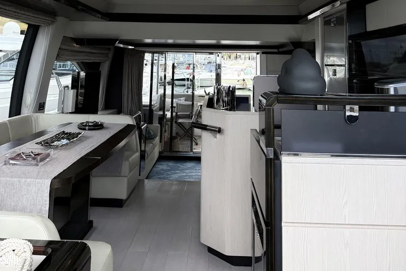 Yacht Photos Pics Luxurious interior of a 2017 Azimut 66 yacht with elegant dining area and modern design.
