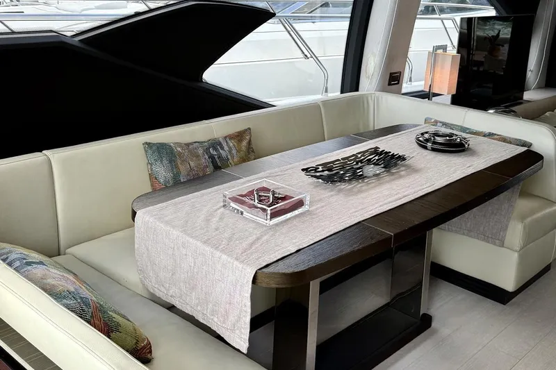  Yacht Photos Pics Luxurious interior of 2017 Azimut 66 yacht with elegant dining area and modern decor.