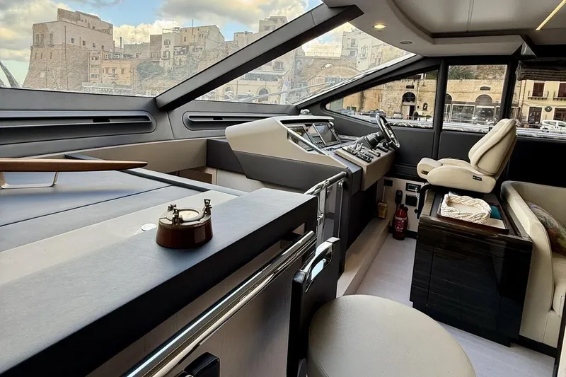  Yacht Photos Pics Luxurious interior of a 2017 Azimut 66 yacht with modern helm and seating.