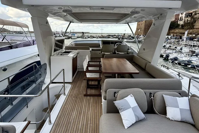  Yacht Photos Pics Luxurious 2017 Azimut 66 yacht deck with elegant seating and dining area.