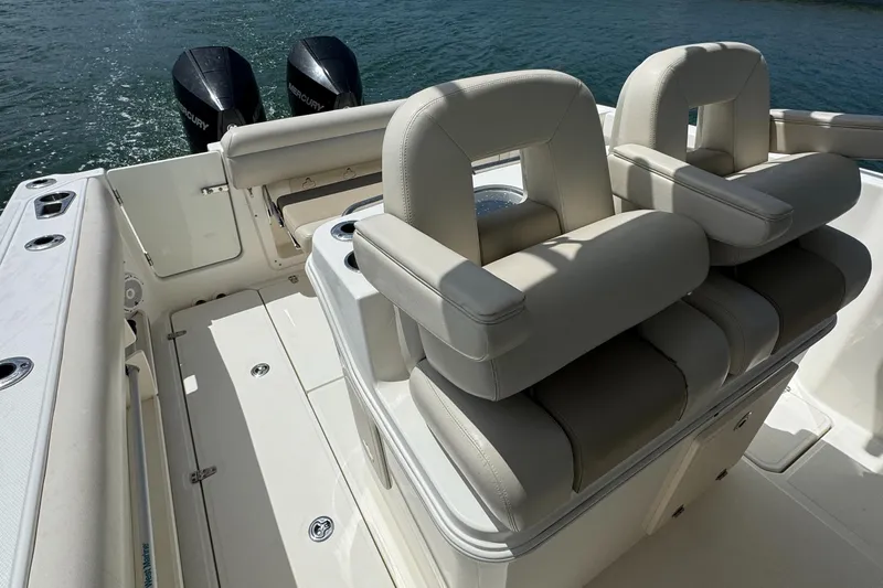  Yacht Photos Pics 2022 Boston Whaler 280 Outrage boat interior with dual seats and twin engines.