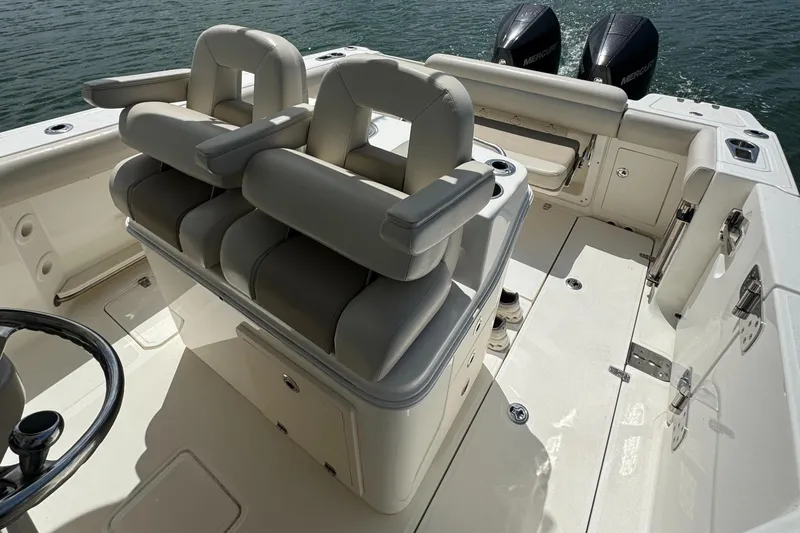  Yacht Photos Pics 2022 Boston Whaler 280 Outrage boat interior with dual seats and twin engines.