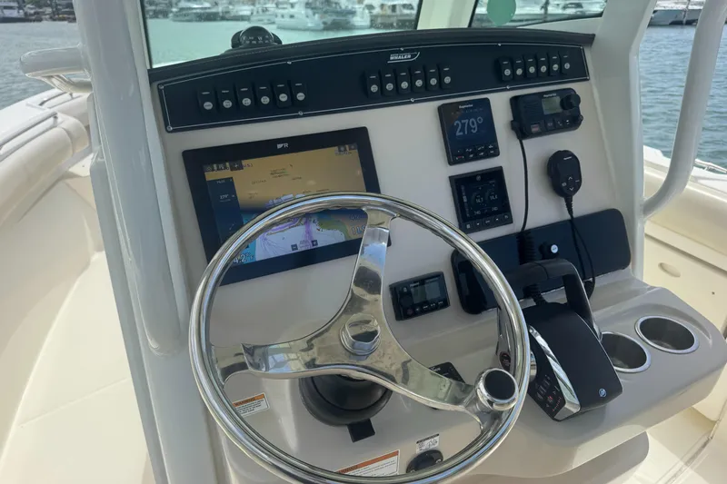  Yacht Photos Pics 2022 Boston Whaler 280 Outrage helm with advanced navigation and control systems.