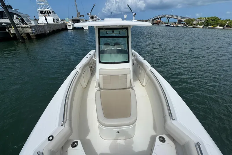  Yacht Photos Pics 2022 Boston Whaler 280 Outrage boat docked in a marina.