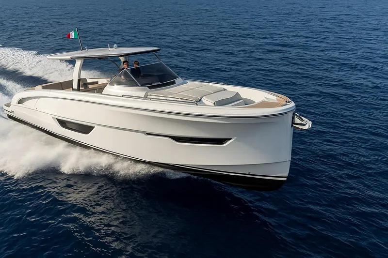  Yacht Photos Pics 2024 Solaris Power 52 Open yacht cruising on open sea, Italian flag visible.