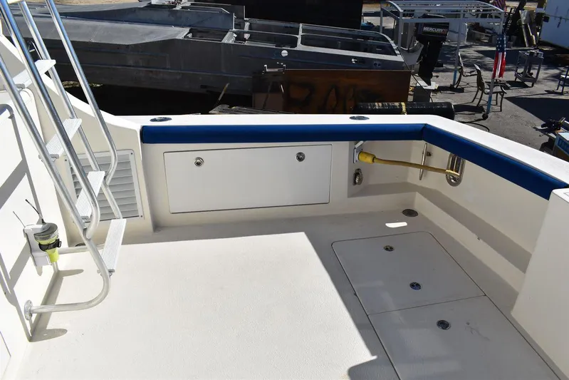  Yacht Photos Pics Egg Harbor 37 Sport Yacht 2005 deck with storage and seating area.