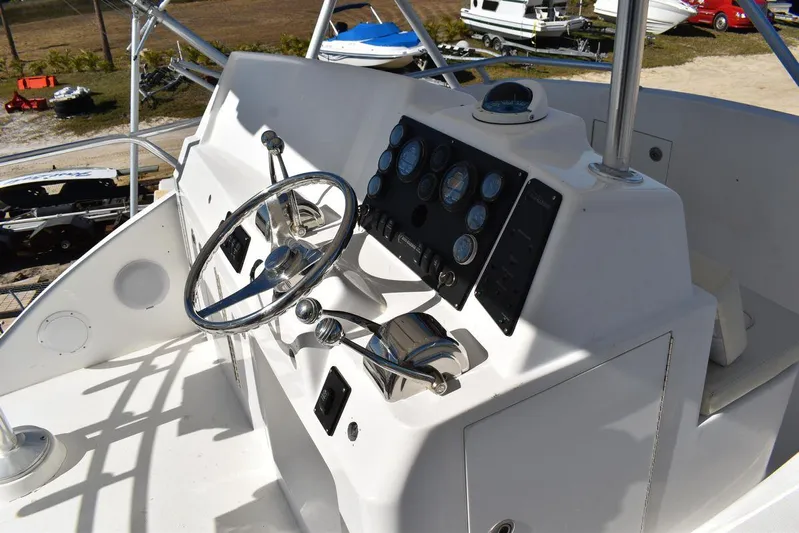  Yacht Photos Pics Control panel of a 2005 Egg Harbor 37 Sport Yacht with steering wheel and gauges.