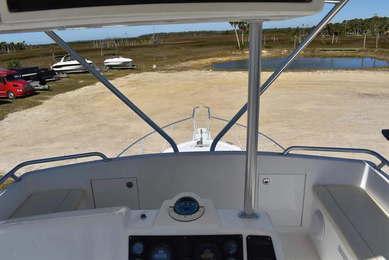  Yacht Photos Pics View from the helm of a 2005 Egg Harbor 37 Sport Yacht, overlooking a marina.