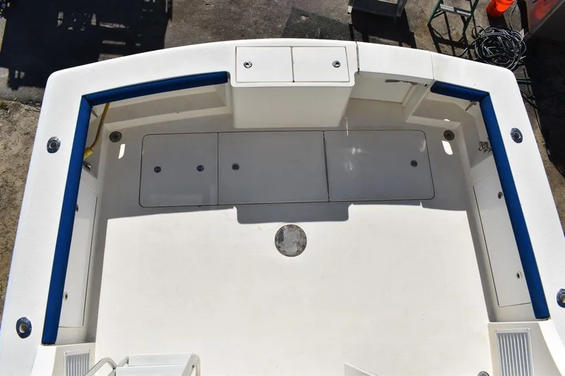  Yacht Photos Pics 2005 Egg Harbor 37 Sport Yacht deck with storage compartments and blue trim.