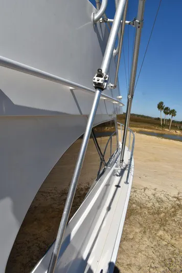  Yacht Photos Pics 2005 Egg Harbor 37 Sport Yacht side view with clear blue sky.