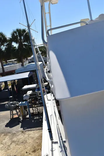  Yacht Photos Pics Egg Harbor 37 Sport Yacht 2005, docked with clear blue sky and palm trees.