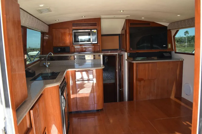  Yacht Photos Pics Interior of 2005 Egg Harbor 37 Sport Yacht with wood cabinetry and modern appliances.