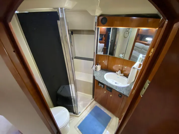 Off Line Yacht Photos Pics Luxurious bathroom in 2006 Cruisers Yachts 52 Express with shower and vanity.