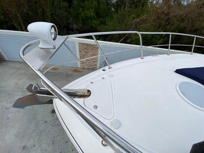 Off Line Yacht Photos Pics 2006 Cruisers Yachts 52 Express bow with railing and anchor detail.