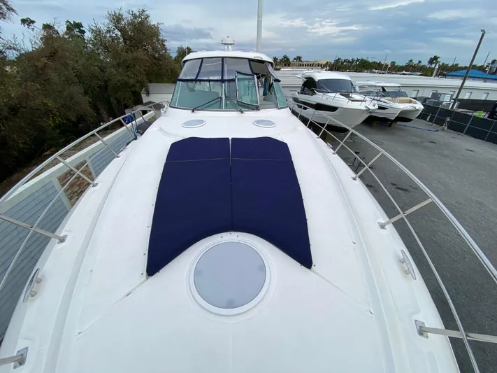 Off Line Yacht Photos Pics 2006 Cruisers Yachts 52 Express on display, featuring spacious deck and sleek design.