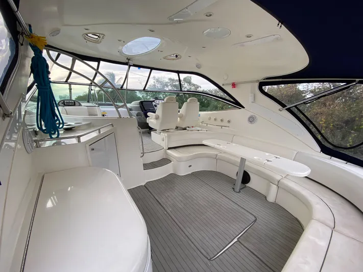 Off Line Yacht Photos Pics Spacious interior of 2006 Cruisers Yachts 52 Express with modern seating and sleek design.