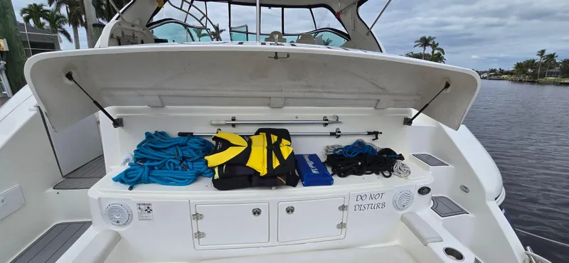 Off Line Yacht Photos Pics 2006 Cruisers Yachts 52 Express boat deck with storage and safety gear.