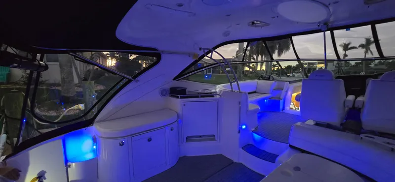 Off Line Yacht Photos Pics Interior of 2006 Cruisers Yachts 52 Express with ambient blue lighting.