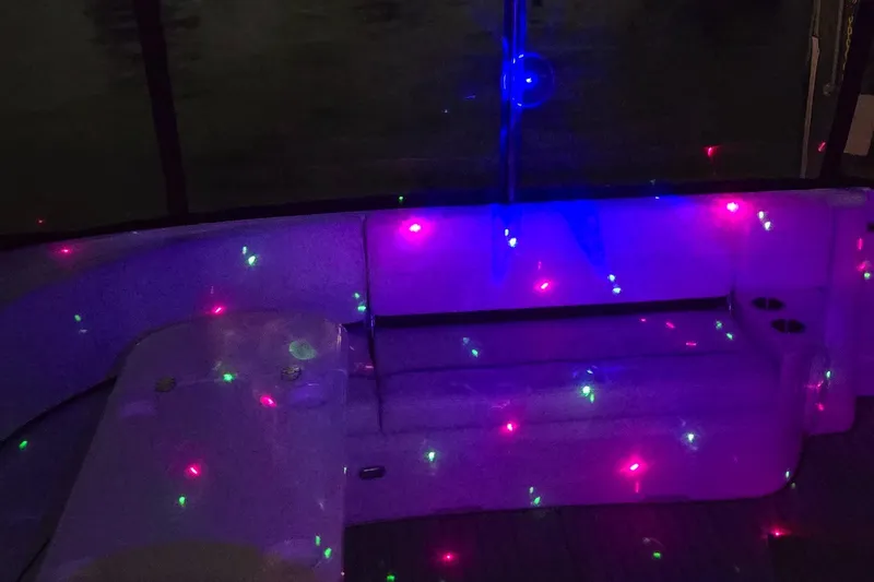 Off Line Yacht Photos Pics 2006 Cruisers Yachts 52 Express interior with colorful LED lights.