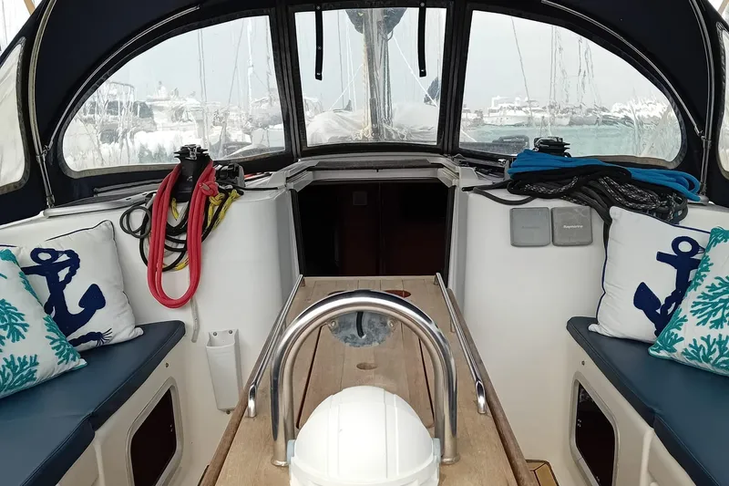  Yacht Photos Pics Cockpit of 2007 Dufour 425 Grand Large sailboat with nautical-themed cushions and equipment.