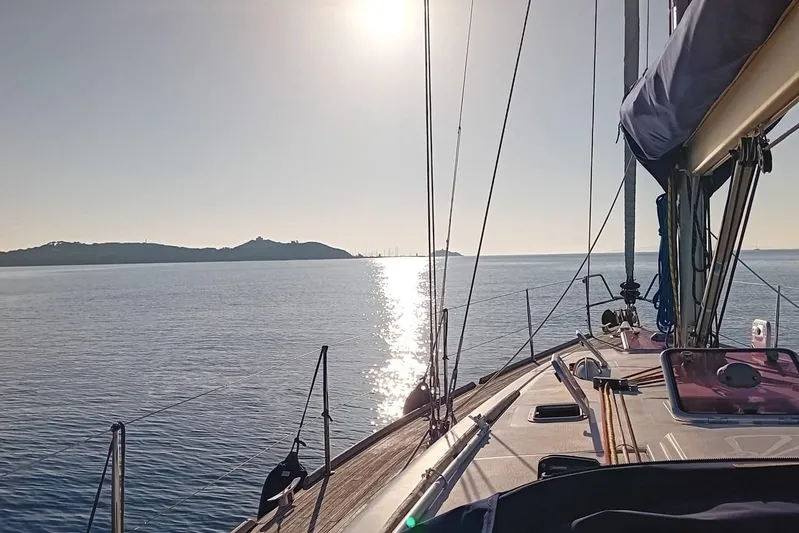  Yacht Photos Pics Sailing on a 2007 Dufour Yachts 425 Grand Large under a bright sunlit sky.