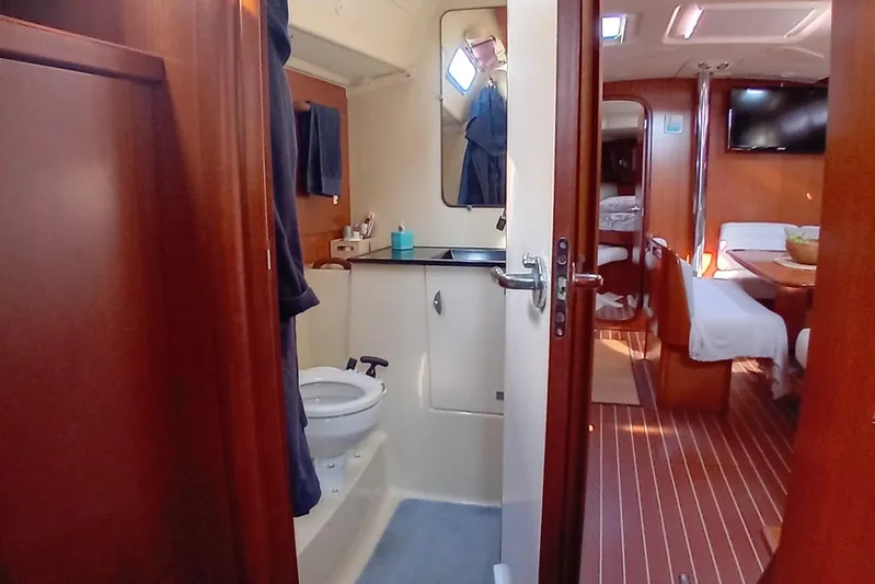  Yacht Photos Pics Interior of 2007 Dufour Yachts 425 Grand Large, featuring bathroom and cozy cabin area.