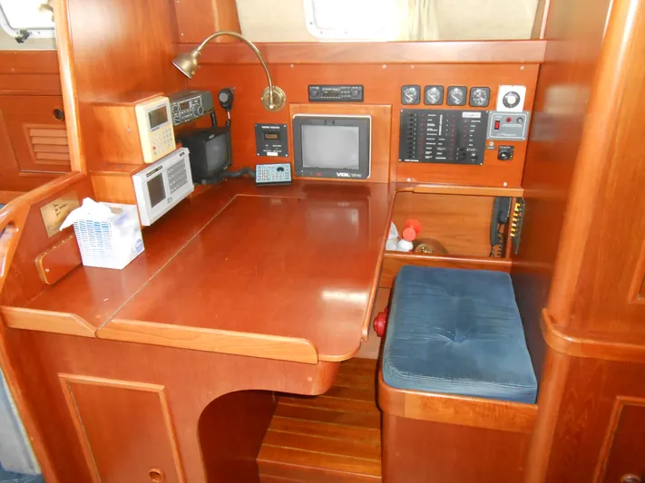 Dutchess Yacht Photos Pics Navigation station in 1985 Contest 41 Ketch with wood finish and electronic equipment.