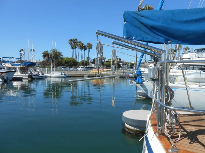 Dutchess Yacht Photos Pics 1985 Contest 41 Ketch sailboat docked in a sunny marina.