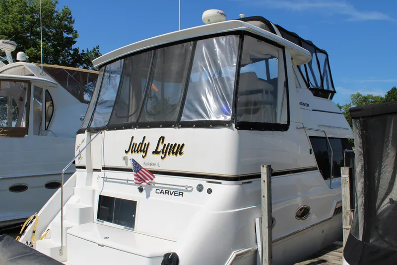 Yacht Photos Pics 2002 Carver 356 Motor Yacht docked, featuring "Judy Lynn" name and American flag.