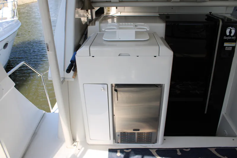  Yacht Photos Pics 2002 Carver 356 Motor Yacht interior with compact kitchen appliances and water view.